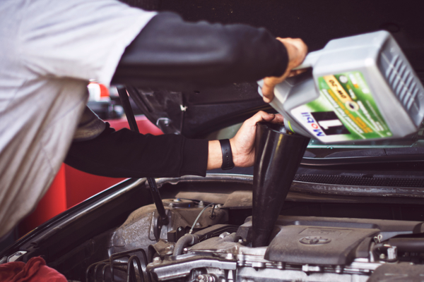 image of a cars getting an oil change
